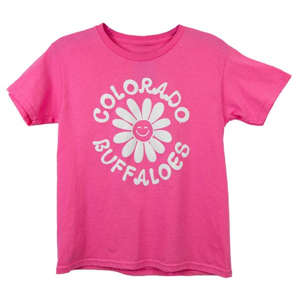A pink youth t-shirt with a white flower printed on it that has a white smiley face in the center of it. "Colorado Buffaloes" is printed around the flower in white bubble lettering.